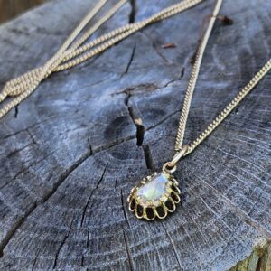 Antique Rose Cut Diamond Pendant on Log Outdoors