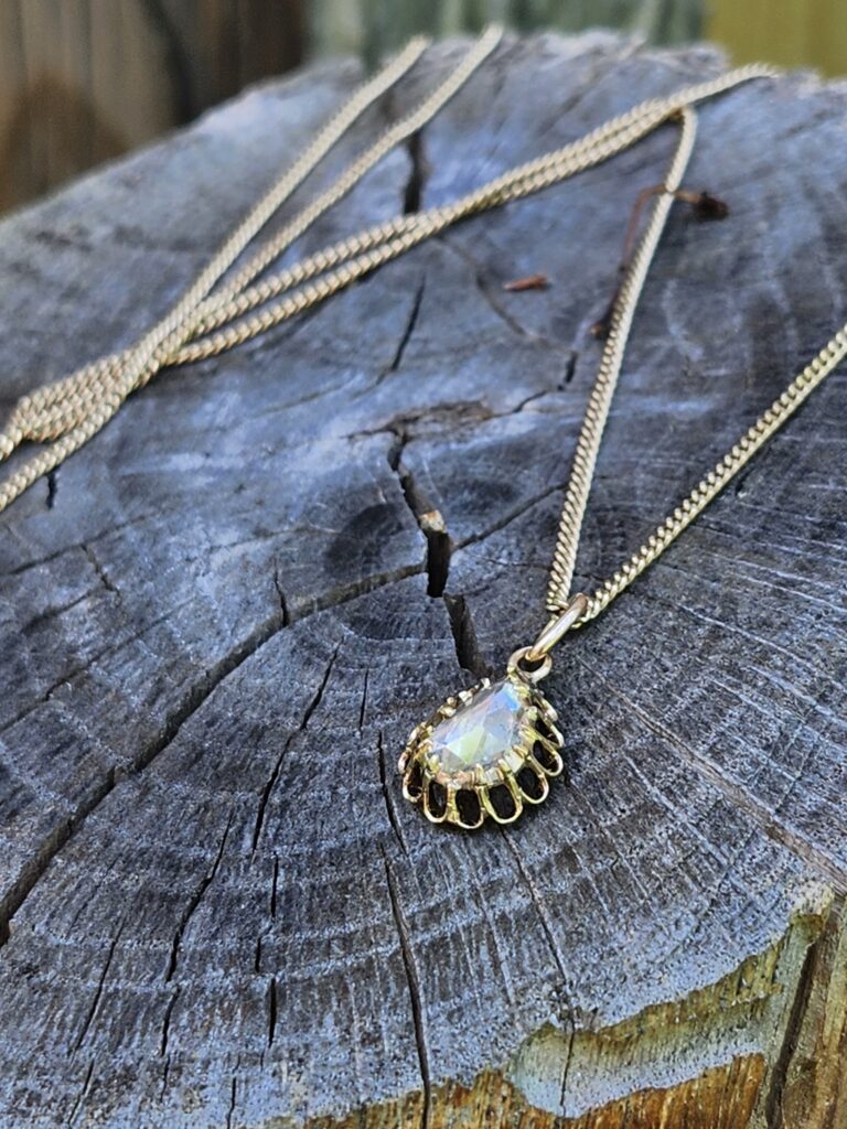Antique Rose Cut Diamond Pendant on Log Outdoors